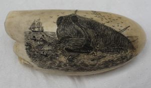 A whale tooth scrimshaw engraved with a scene of a whaling crew being attacked and capsized by a