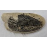 A whale tooth scrimshaw engraved with a scene of a whaling crew being attacked and capsized by a