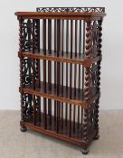 A Victorian rosewood music cabinet, with a pierced gallery above three shelves,