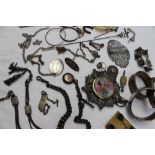 A quantity of silver and white metal jewellery, including hinged bangles, nurses belts,
