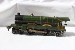 An O gauge 4-4-2 locomotive in green livery together with another "Caerphilly Castle" and a Hornby