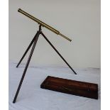 A 19th century lacquered brass telescope with a 3" tube and separate eye pieces,