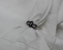 A sapphire and diamond set ring, the marquise sapphire estimated at 0.