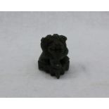 A green jade model of a Dog of Foo, in dark green,