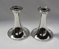 A pair of George V desk candlesticks, with a flared rim and spreading foot, Birmingham, 1919,
