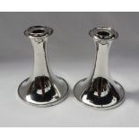 A pair of George V desk candlesticks, with a flared rim and spreading foot, Birmingham, 1919,