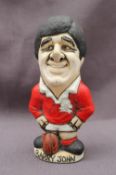 A John Hughes pottery Grogg of Barry John, in red Welsh jersey with number 10 on his back,