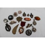 A hardstone brooch, together with other brooches,