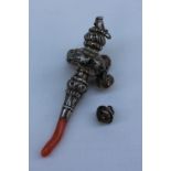 A late Victorian silver baby's rattle, with coral teether, whistle and bells,