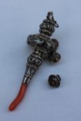 A late Victorian silver baby's rattle, with coral teether, whistle and bells,