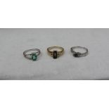 An emerald ring the oval stone set in 9ct white gold together with a Labradorite and white topaz