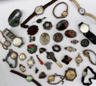 A Scottish hardstone brooch in the form of a thistle, together with assorted brooches, wristwatches,