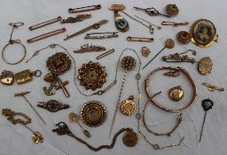 Assorted 9ct gold and yellow metal pendants, brooches, stick pins etc,