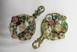 A pair of 19th century floral encrusted chamber sticks,