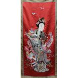 A Chinese red silk wall hanging,