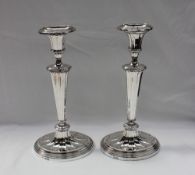 A pair of late Victorian silver candlesticks, of oval form,