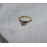 A solitaire diamond ring, the old round cut diamond approximately 0.75 of a carat