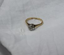 A solitaire diamond ring, the old round cut diamond approximately 0.75 of a carat