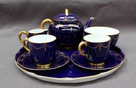 A Royal Worcester tea for two set, comprising a tray, teapot with bamboo handle, two cups,
