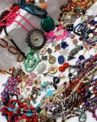 An assortment of costume jewellery including bead necklaces, bracelets,