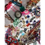 An assortment of costume jewellery including bead necklaces, bracelets,