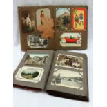 Two postcard albums containing circa 300 cards including Irish Life, views of Tranmore, Aberystwyth,