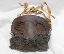A World War I tank crew splatter mask, with a chain mail mouth guard,