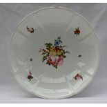 A 19th century Swansea porcelain circular lobed bowl painted with a central spray of garden flowers