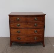 A George III mahogany chest, the bow front above four long drawers on splayed bracket feet,