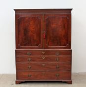 A Victorian mahogany linen press, the moulded cornice above a pair of panelled doors,