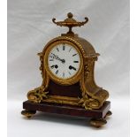 A 19th century ormolu and variegated red marble mantle clock,