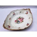 A 19th century Swansea porcelain large lobed dish, painted with sprays of garden flowers,