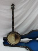 An Abbott of London four string banjo, with mother of pearl inlay,