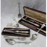A French white metal carving set, comprising knife, fork and bone holder,