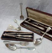 A French white metal carving set, comprising knife, fork and bone holder,