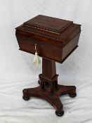 A Victorian rosewood teapoy, the rectangular hinged top enclosing a glass bowl,