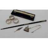 A George V silver and ebonised conductors baton, in two pieces with a screw mechanism,