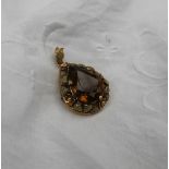 A Citrine and yellow metal Pendant,