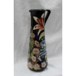 A Moorcroft limited edition jug, of tapering cylindrical form with triangular handle,