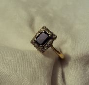 A Sapphire and diamond ring,