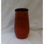 A T W Lemon's Wesuma ware pottery vase, with an orange ground incised with flowers and leaves,