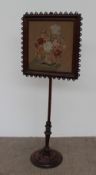A Victorian walnut pole screen,