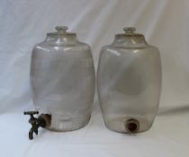 An engraved glass beverage dispenser of barrel shape, engraved with bands, with a tap at the base,