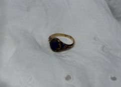 A blue enamel and diamond decorated dress ring to a yellow metal setting and shank