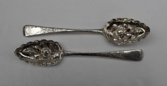 A late George III silver berry spoon, London, 1809, together with another, London, 1816,