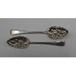 A late George III silver berry spoon, London, 1809, together with another, London, 1816,