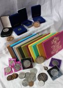 Assorted coins including proof minted silver Isle of Man one pound coins, various crowns,