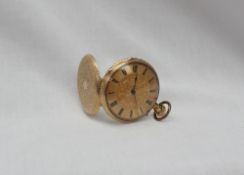 An 18k yellow gold keyless wound open-faced pocket watch, the yellow metal dial with Roman numerals,