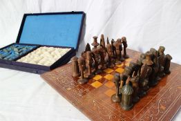 An African carved wood chess set, King 9.5cm high, Pawn 7.