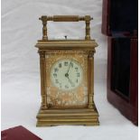 A late 19th century gilt brass striking and quarter repeating carriage clock,